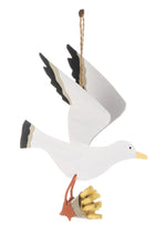 Large hanging seagull stealing chips