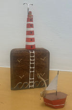 Lighthouse on wooden block