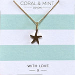 Gold starfish charm necklace
